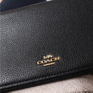 Coach Black pebbled Leather clutch or crossbody